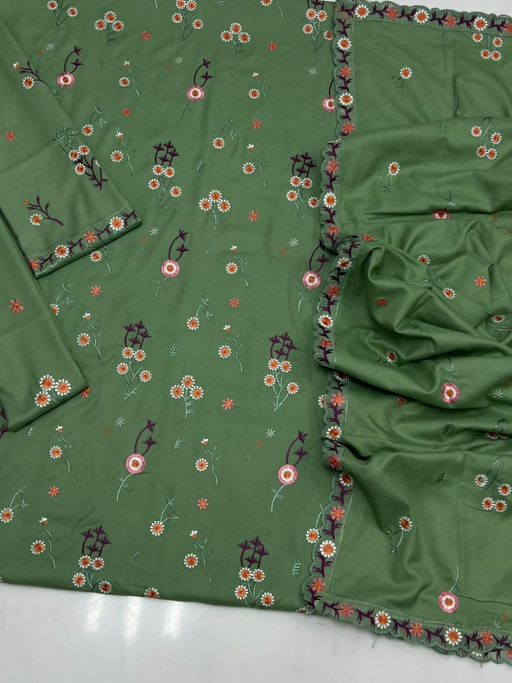 Green embroidery detail