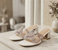 White synthetic leather fancy block heels with clear printed strap